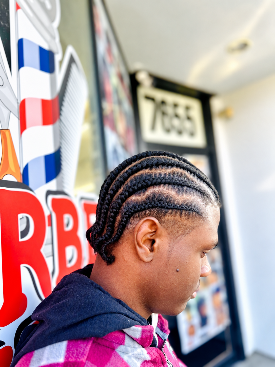 Straight cornrows side view at AD Blades and Braids